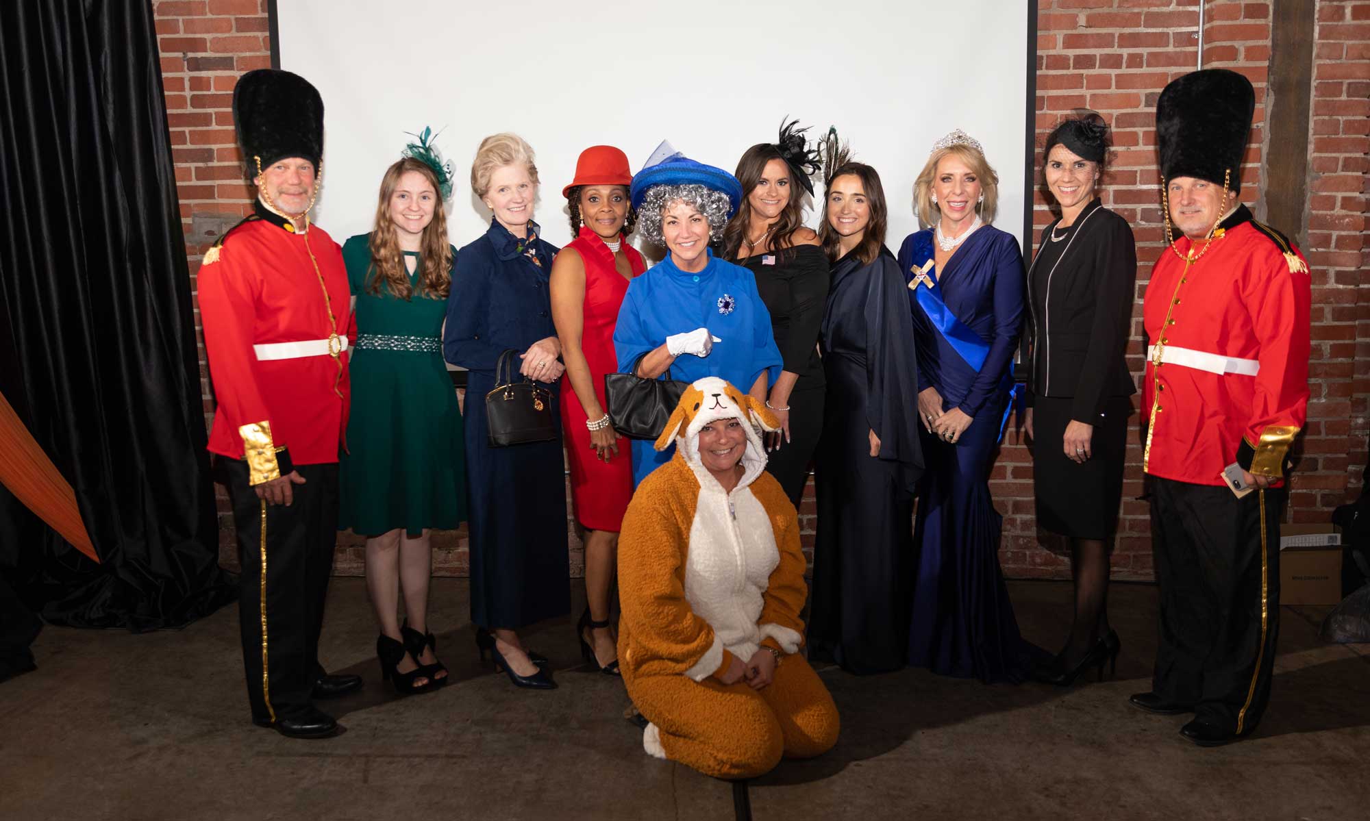 A group of people in costumes posing for a photo.